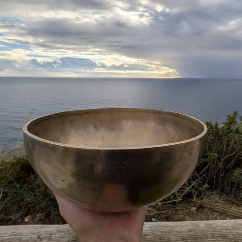 Breathtaking view of a lavender field at sunset with a vibrant pastel sky, embodying tranquility and nature's beauty.